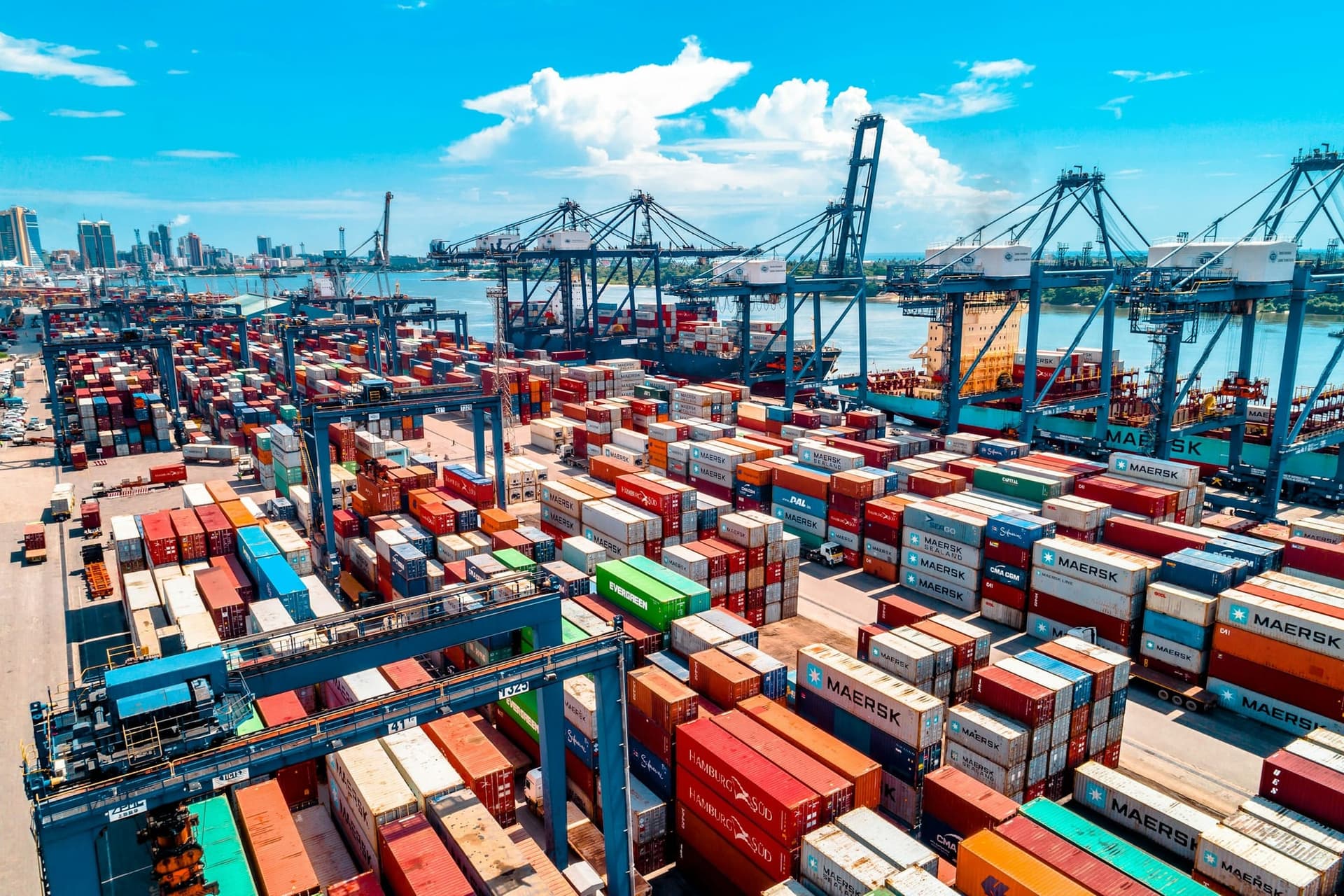 Shipping containers stacked at a port terminal awaiting loading