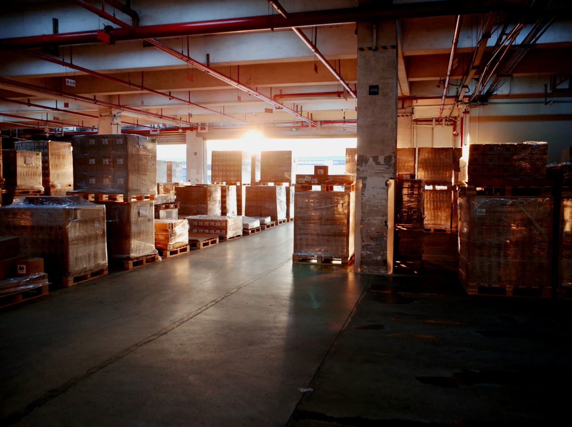 Palletised consumer goods stacked in a distribution warehouse